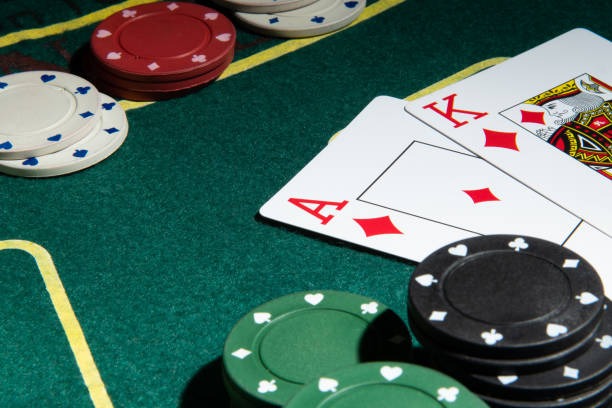 Live baccarat dealer studio showing multi-camera feed and card layout